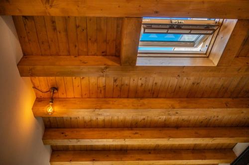 an overhead view of a wooden ceiling with a window at A casudda in Noto