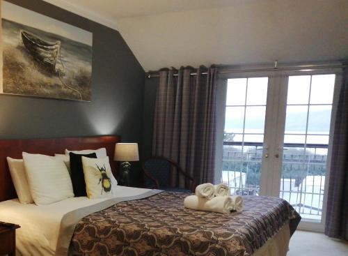 Ένα ή περισσότερα κρεβάτια σε δωμάτιο στο Three Rivers Hotel