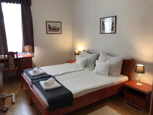 Cama o camas de una habitación en Huszárvár Hotel Kastélyszálló