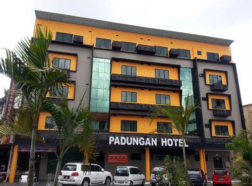 
a large building with a lot of windows in front of it at Padungan Hotel in Kuching
