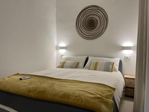 Ένα ή περισσότερα κρεβάτια σε δωμάτιο στο Casa Vacanze Portopalo.66
