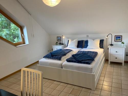 a bedroom with two beds and a window at Lovely Central Located- Train, Restaurants & Spa in Kassel