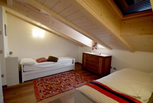 En eller flere senge i et værelse på APPARTAMENTO GIRASOLE