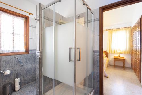 a shower in a bathroom with a glass door at CASA GOLF beautiful views with private pool in San Miguel de Abona