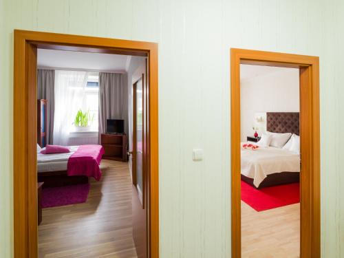Ein Bett oder Betten in einem Zimmer der Unterkunft Hotel Bonsai