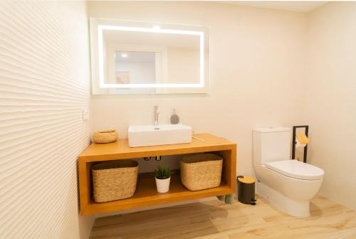 a bathroom with a sink and a toilet at Alojamiento MAS EL CASTELL DEL BRULL in El Brull
