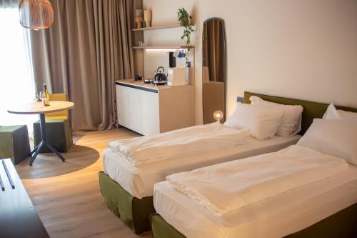 Una cama o camas en una habitación de Hotel Fossa Mala