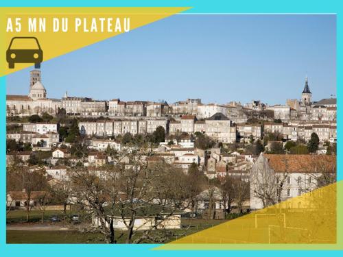 a view of a city with a bus on a hill at Appartement T2- Le bon accueil / WIFI / PARKING in Angoulême