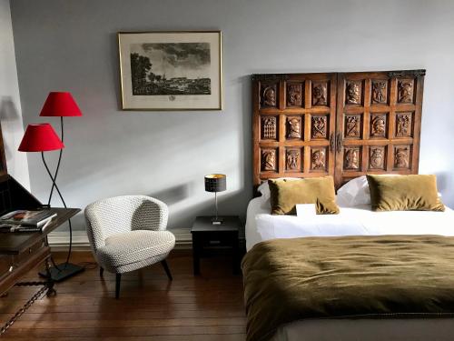 מיטה או מיטות בחדר ב-La bohème - Chambres d’hôtes