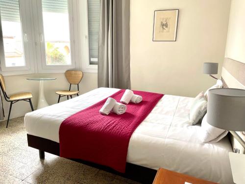 מיטה או מיטות בחדר ב-Hôtel Restaurant Gédéon