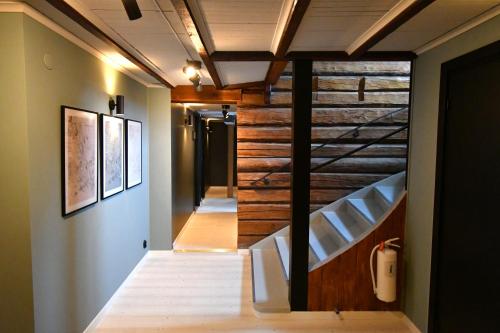 a staircase in a house with wooden walls and ceilings at Skars Lodge / North Mountain Lodge in Funäsdalen