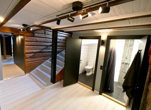 a room with a staircase and a toilet in it at Skars Lodge / North Mountain Lodge in Funäsdalen