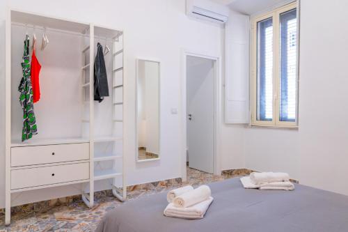 Postel nebo postele na pokoji v ubytování Via Malta Cozy Apartments near Ortigia