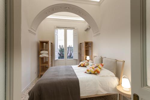 A bed or beds in a room at VITTORIO EMANUELE HOUSE