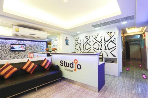 a lobby of a mulovo making store with a couch at Studio Nana by iCheck inn in Bangkok