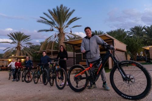 a group of people standing with their bikes at Ras Hasita in H̱aẕeva