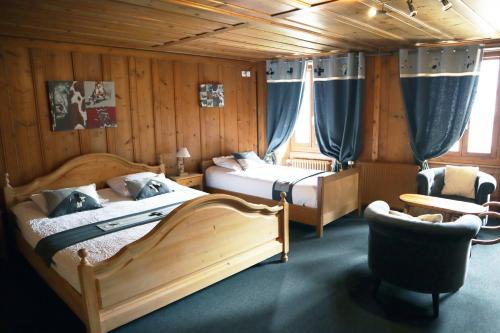 Postel nebo postele na pokoji v ubytování Gruyère Rooms