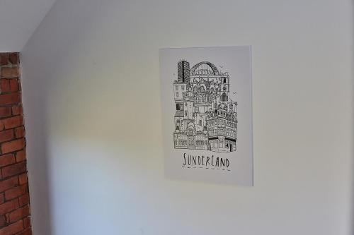 a drawing of a building on the side of a refrigerator at No 8 at Simpson Street Apartments Sunderland in Sunderland