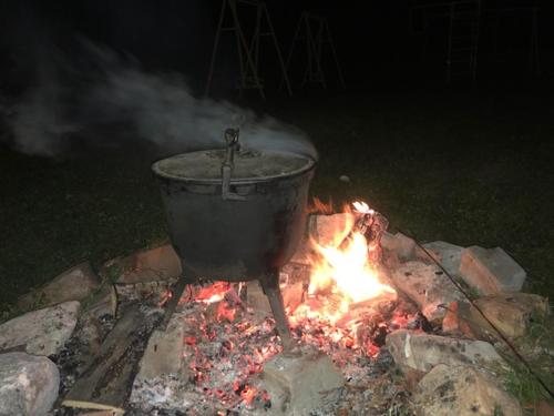 a pot sitting on top of a fire at Nasz Dom in Kościelisko