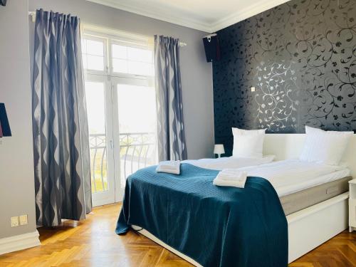 Postel nebo postele na pokoji v ubytování aday - Aalborg City Center big apartment
