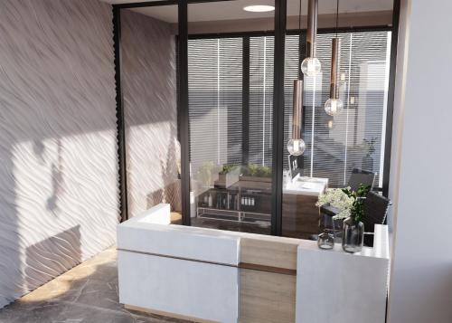 a bathroom with a white sink and a mirror at Vila Natalia in Eforie Nord