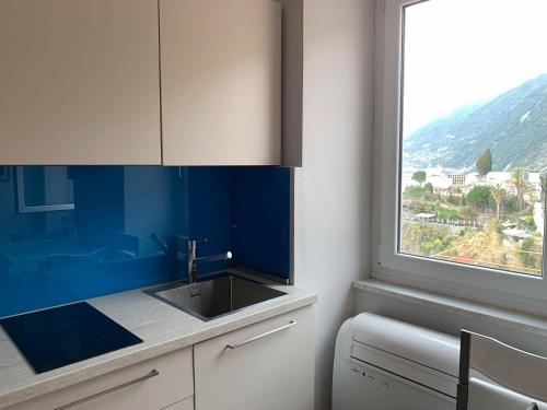 a kitchen with a sink and a window at Dal Comandante by Arbaspàa in Manarola
