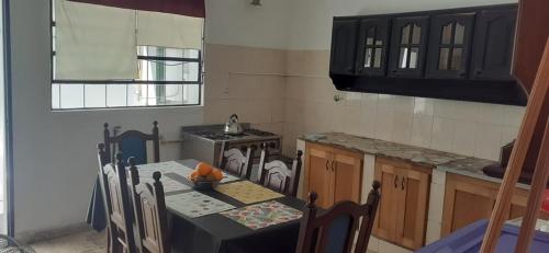 A kitchen or kitchenette at ezeiza alojamiento