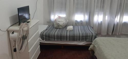 A bed or beds in a room at ezeiza alojamiento