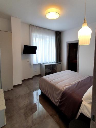 Una cama o camas en una habitación de WeRooms