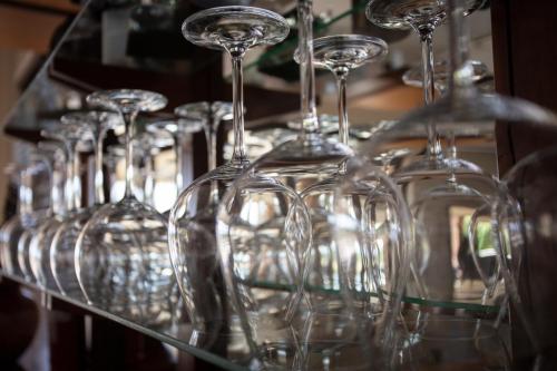 a row of wine glasses sitting on a shelf at Buffalo Brooke in Hectorspruit
