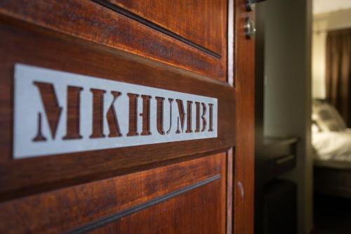 a wooden door with the word mitzhovitz on it at Buffalo Brooke in Hectorspruit