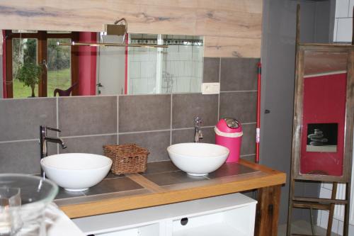 a kitchen with two white bowls on a counter at Les Chanterelles in Jalhay