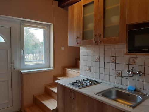 Kuchyň nebo kuchyňský kout v ubytování Egniss Apartman 2