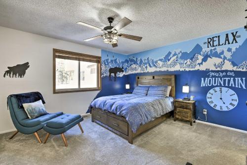 a bedroom with a bed and a clock on the wall at Colorful Condo in Pagosa Springs with Patio! in Pagosa Springs