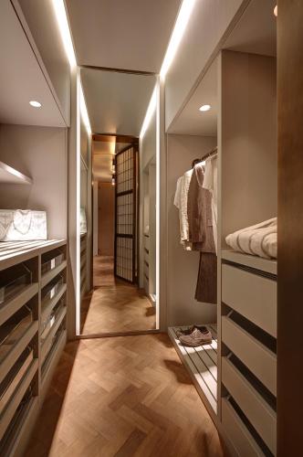 a bathroom with a walk in closet with a mirror at Hotel Cafe Royal in London