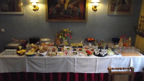 a white table with food on top of it at Waldschlösschen in Mittenwalde