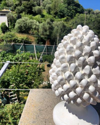a white sculpture sitting on top of a building at Donna Caterì in Termini