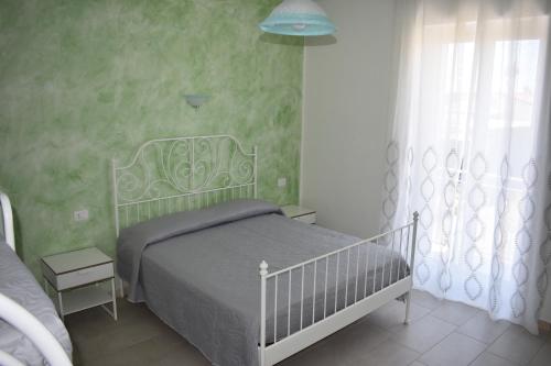 Postel nebo postele na pokoji v ubytování B&B Da Zio Peppe