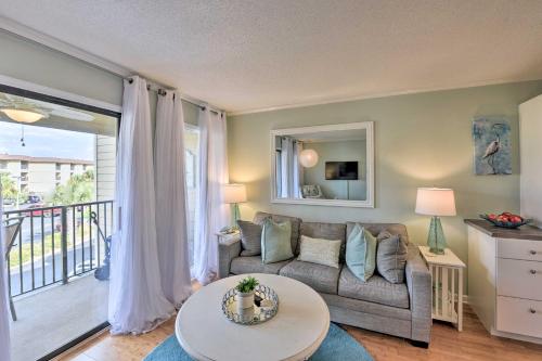 a living room with a couch and a table at Beach and Pool Access Hilton Head Family Escape! in Hilton Head Island