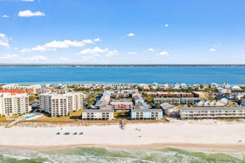an aerial view of the beach and buildings at Villas on the Gulf in Gulf Breeze