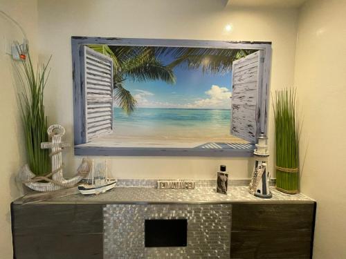 a bathroom with a window with a view of the ocean at Luxury Beachhouse Apartment Boa Vista in Sal Rei