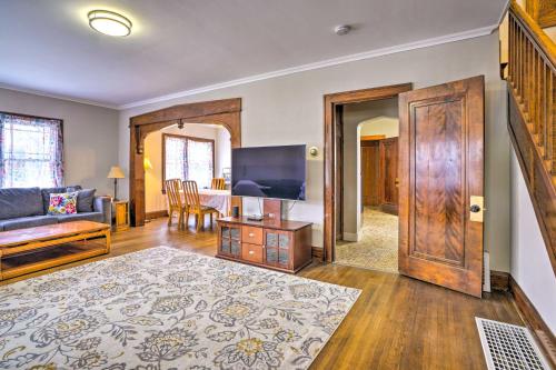 a living room with a couch and a tv at White House of Red Wing with Wii Video Game! in Red Wing