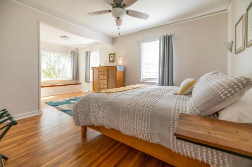 a bedroom with a bed and a ceiling fan at Waterfront Edenton Bay Cottage - Walk to Dtwn in Edenton