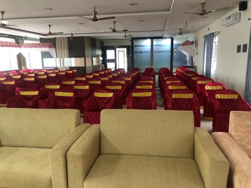 a room with chairs and couches in a room at GRAND Meridian in Pyāpali