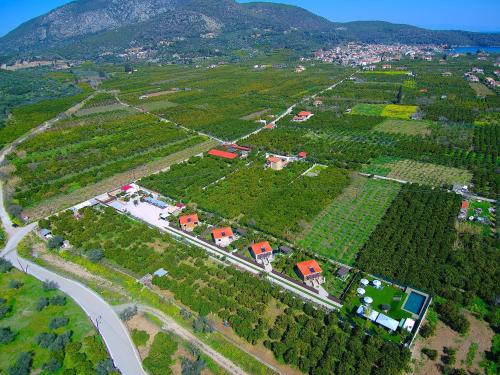 an aerial view of a village with houses and a road at Desa Green Homes in Ancient Epidavros