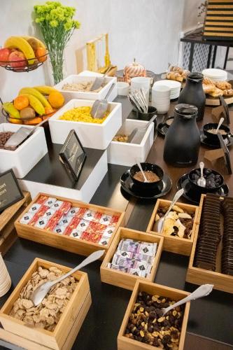 a buffet with many different types of food on a table at Hotel Capital with private wellness in Nitra
