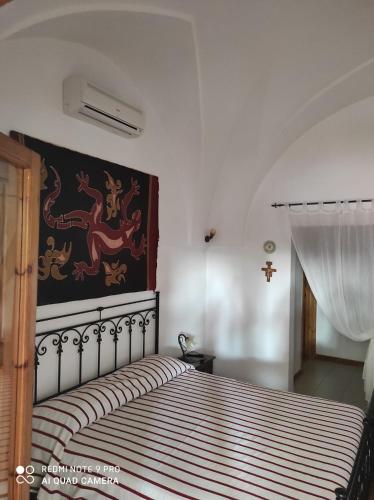 Postel nebo postele na pokoji v ubytování Al Vecchio Trullo