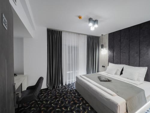 Ein Bett oder Betten in einem Zimmer der Unterkunft Hotel Anastasia