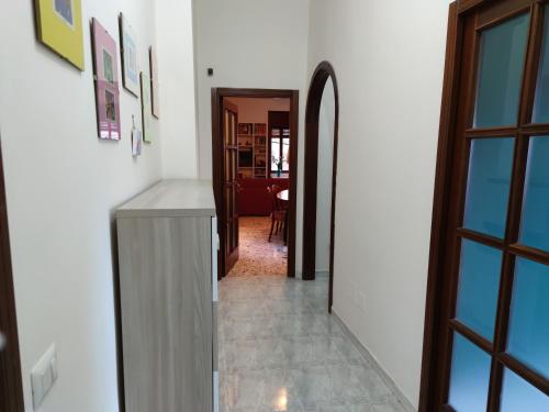 a hallway leading into a living room with a door at CASA VACANZE "A casa di Maria" in Naples
