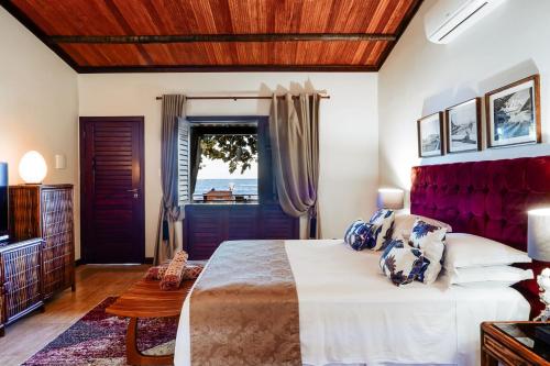 Postel nebo postele na pokoji v ubytování Hotel Pousada Boutique Coco Bambu Morere